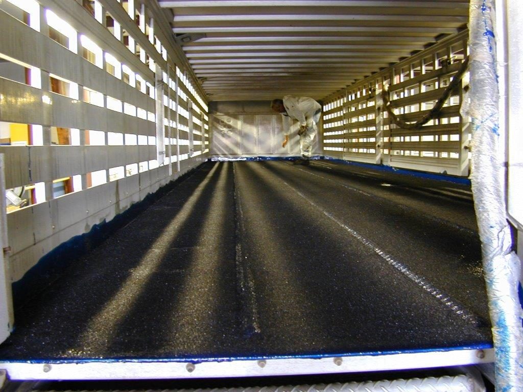 Aluminum trailer roof being coated with a flexible polyurea membrane
