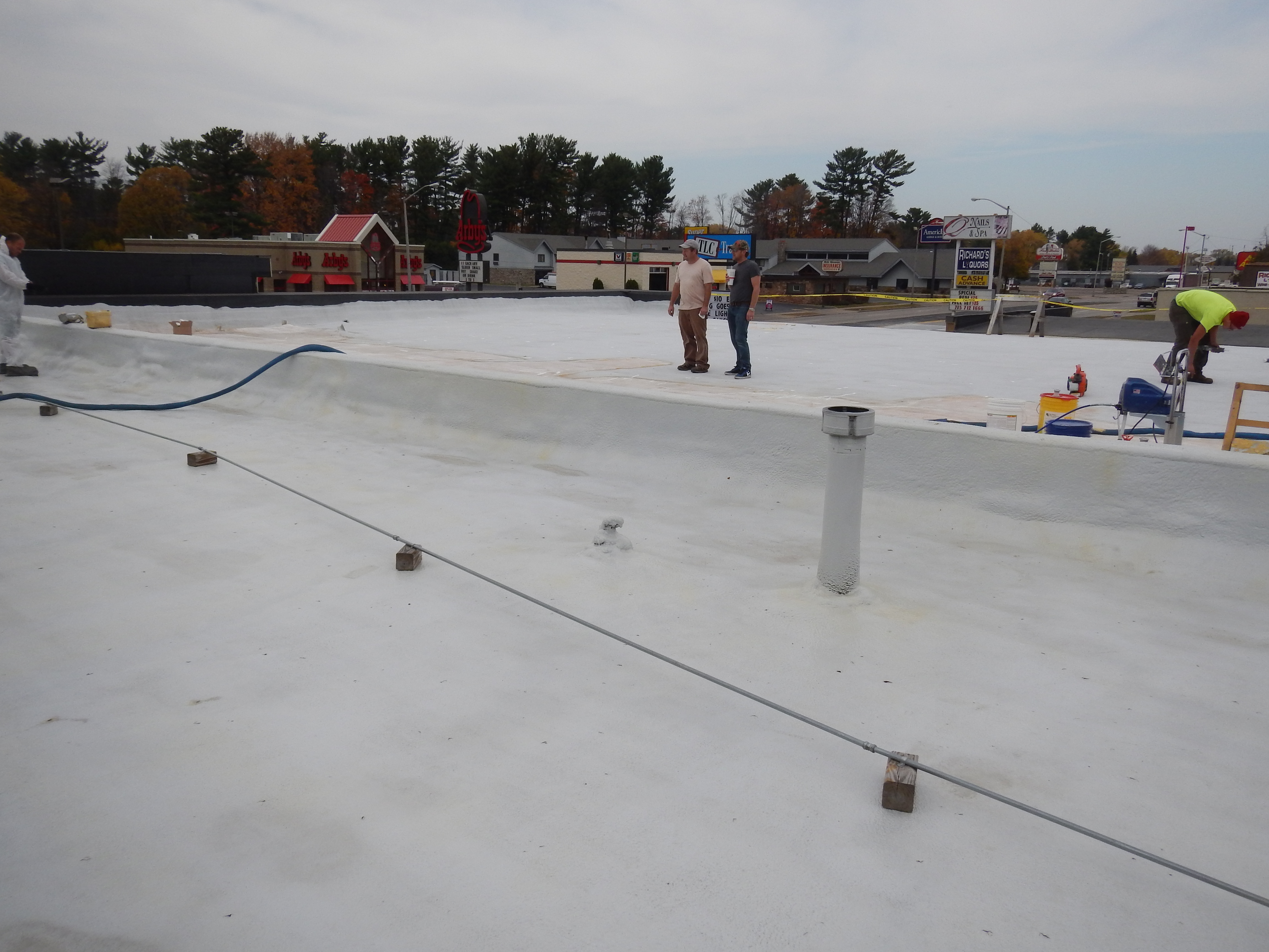 Completed polyurea roof membrane on a metal building