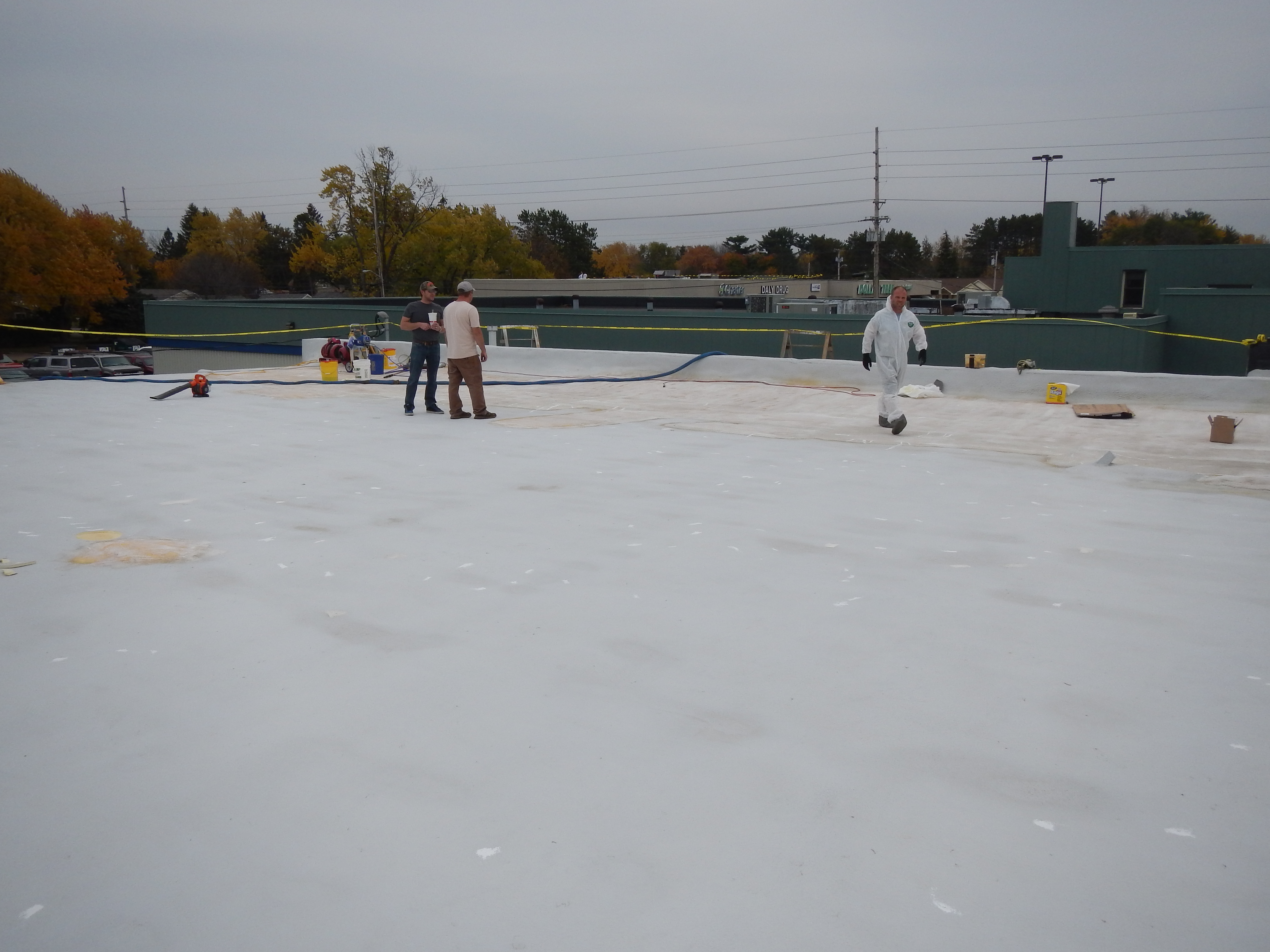 Finished polyurea roof membrane on a low-slope commercial building