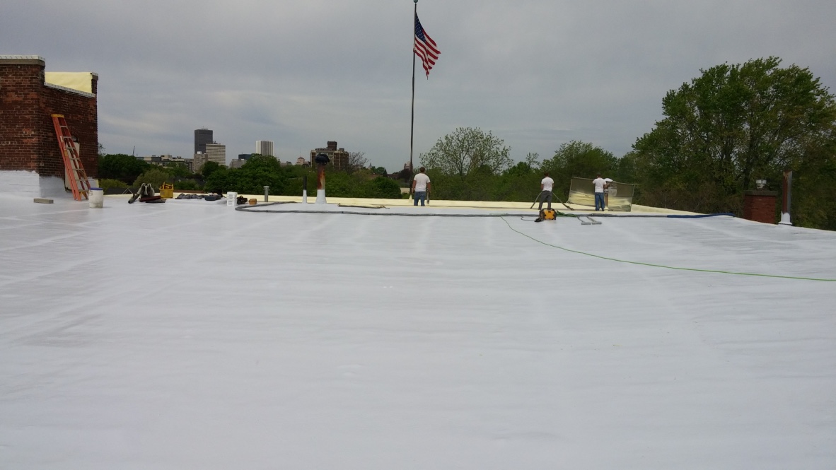 Coastal commercial roof protected with polyurea membrane coating
